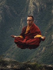 A man in red monk robes levitating cross-legged in front of a misty mountain face