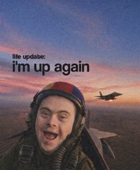 A grinning man in a fighter-pilot helmet in a jet cockpit at sunset, captioned: life update: i'm up again